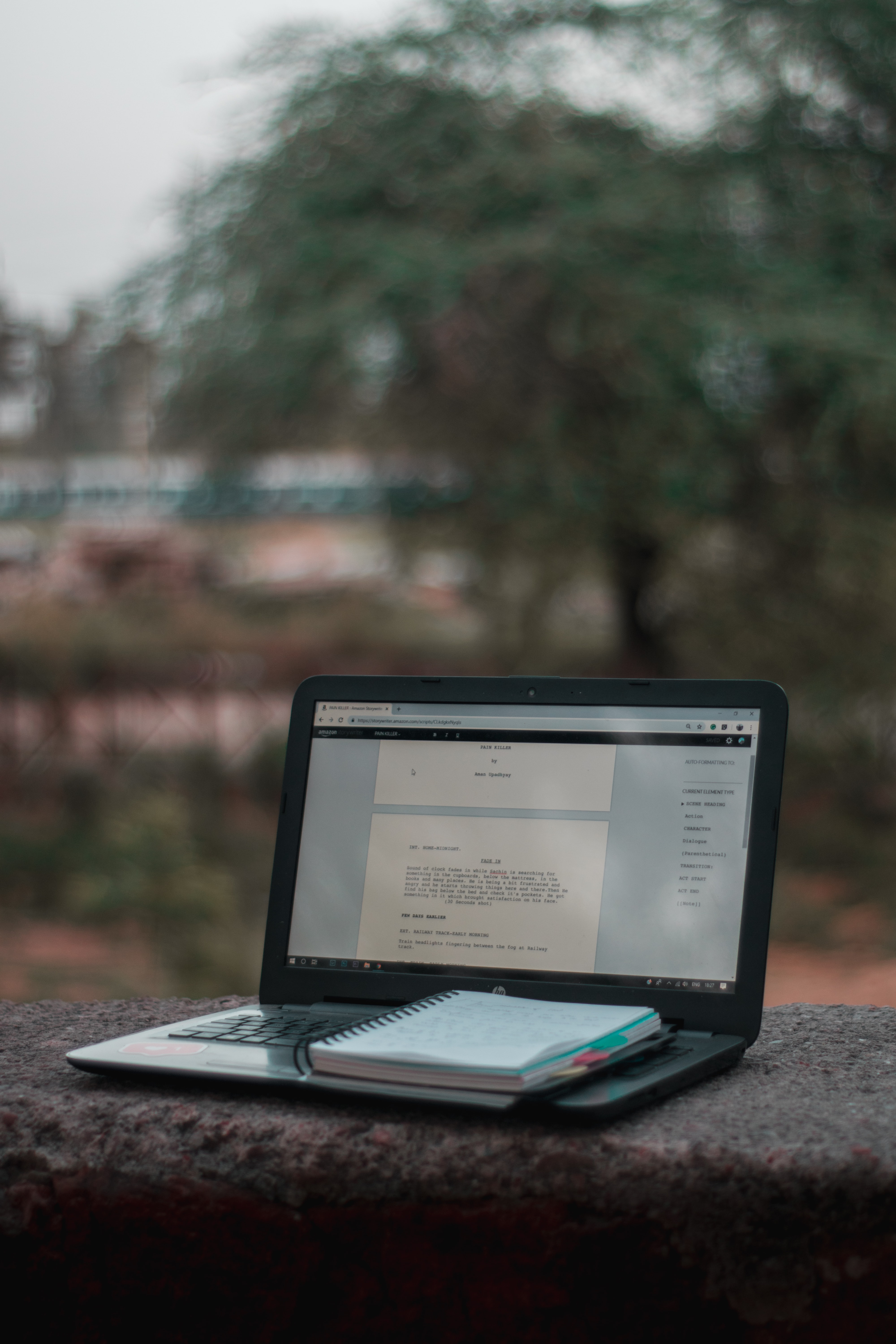 A close view of a notebook and writing materials